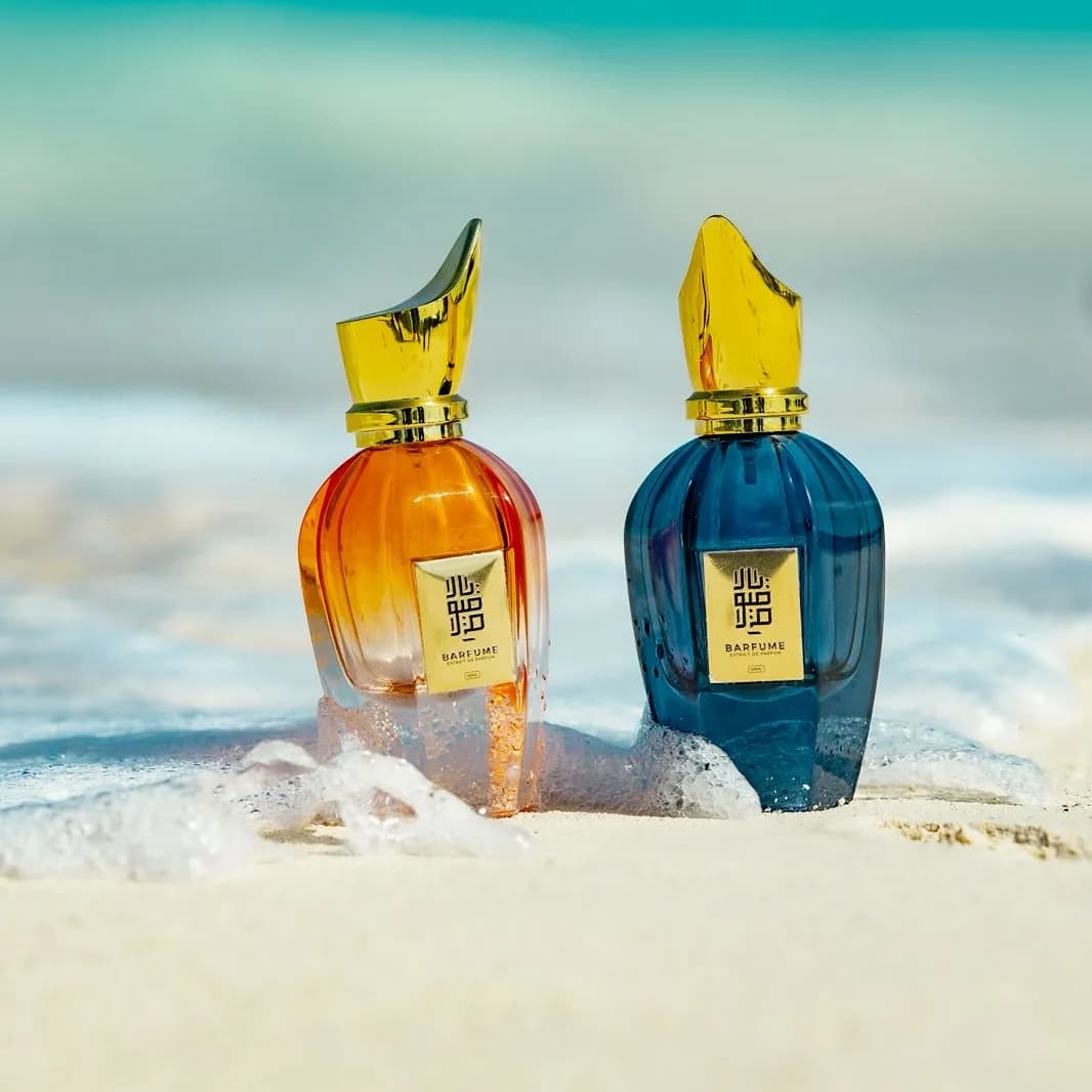 Amber and blue Barfume bottles standing at the waterline